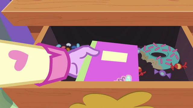 File:Twilight puts Fluttershy's notebook in the drawer EG2.png