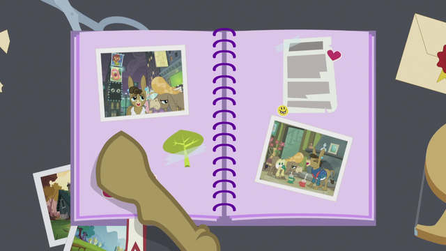 File:Matilda opens scrapbook S5E9.png