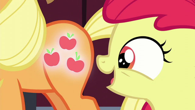 File:Apple Bloom looks at Applejack's glowing cutie mark S5E17.png