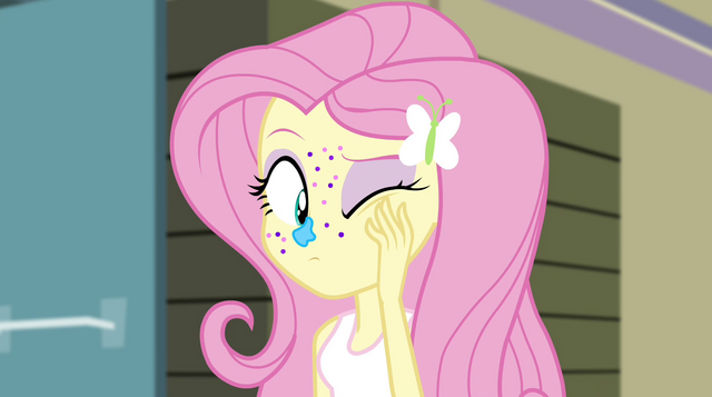 File:Fluttershy rubbing her face EG2.png