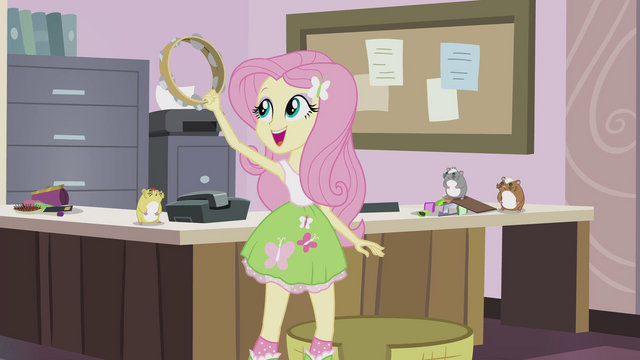 File:Fluttershy holding up tambourine EG2.png