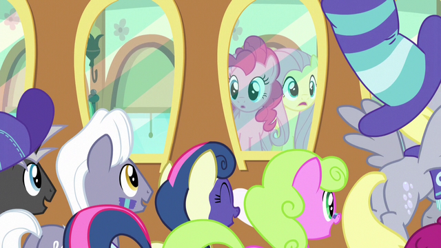 File:Pinkie and Fluttershy looking at their fans S6E18.png