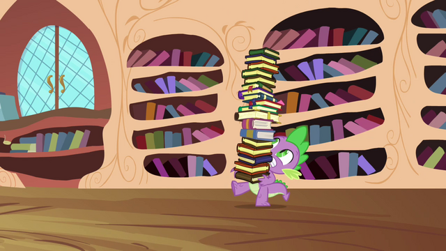 File:Spike carrying a tower of books S03E10.png