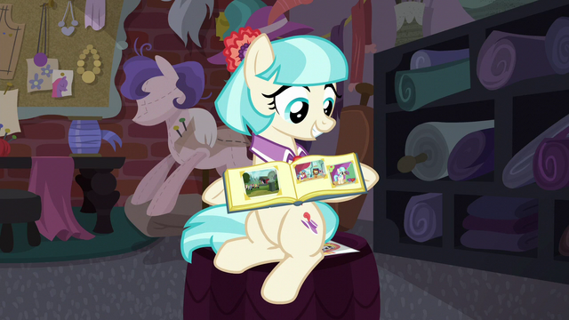 File:Coco opens her photo album S5E16.png