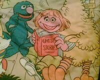 Pink muppet on quilt
