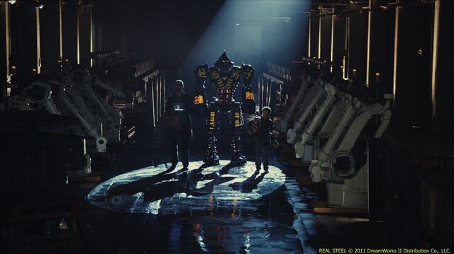 File:Charlie (hugh jackman) and his son, max (dakota goyo) enter former wrb robot noisy boy in an underground match.jpg