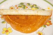 Roly-Poly Pancake Mango Jam filling being rolled up.