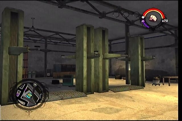 File:Donnie's second garage as it appears in Saints Row - interior work area car lifts.jpg