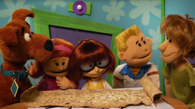 File:Gang look over map (puppet film).png