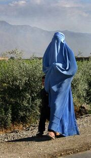 345px-Woman walking in Afghanistan