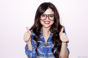 Selena Gomez wearing glasses