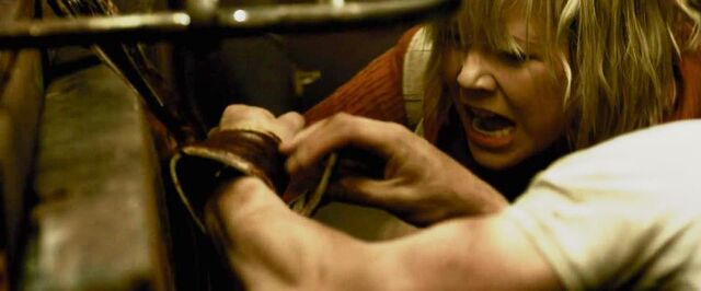 File:Heather helps Vincent undo the straps.jpg