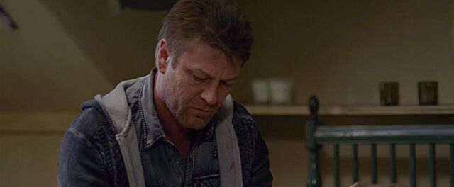 File:Looks at the writing.jpg
