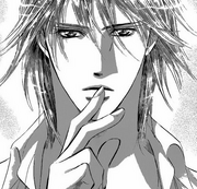 Corn pointing his fingers into his lips