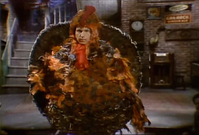 File:Paul Simon (1970s Review).png