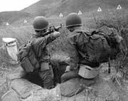 220px-ARVN Recruit Trains with M16 Rifle