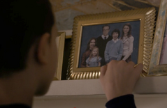 Eleven looks at the Wheeler family photo