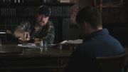 Bobby pouring Dean a drink