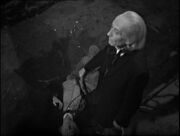 The Doctor stood over robot The Chase-5