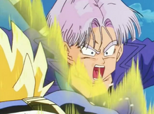 Vegeta punches Future Trunks in the stomach