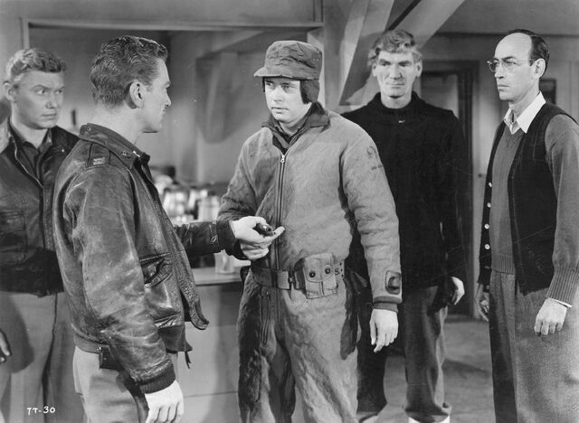File:Bob brings news of the Thing's escape - The Thing (1951).jpg