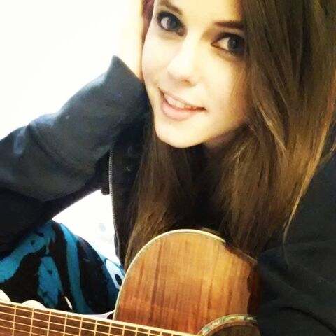 File:Tiffany jamming on guitar - February 2, 2014.jpg