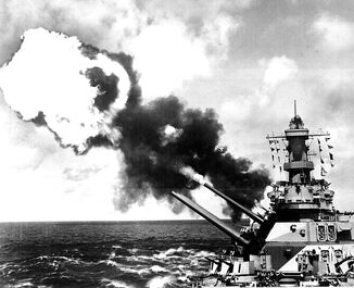 738px-Sixteen-inch guns of the USS Iowa firing-1-