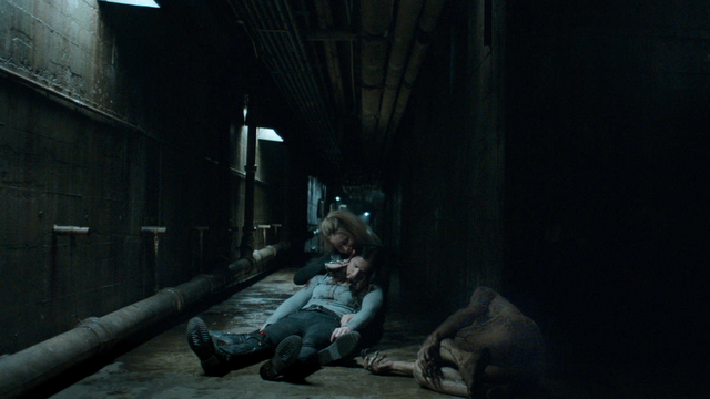 File:Nothing Matters 1x06 Susan hold Vanessa next to dead mutated vampire.png