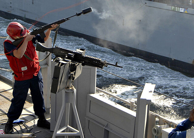 File:US Navy 090107-N-3392P-065 Gunner's Mate Seaman James Clarke fires a shot line to the Military Sealift Command dry cargo-ammunition ship USNS Lewis and Clark (T-AKE 1).jpg