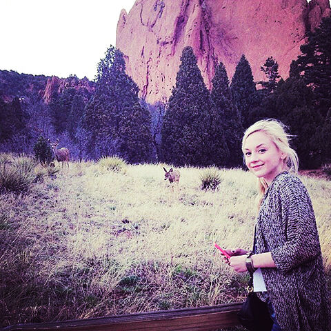 File:Emily Kinney wildlife looking at deer so cool and cute.jpg
