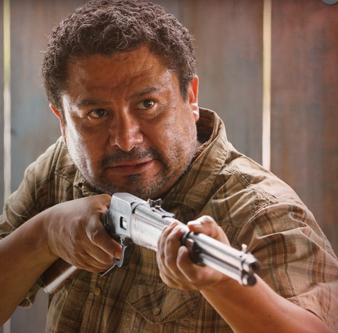 File:MexicanmanwithagunaimedatChrisandfriends.png