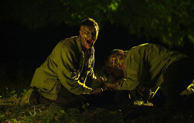 File:Zombies eating .jpg